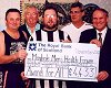 Fitness cheque:Councillor Andy Hill (right), Leader of South Ayrshire Council, hands over a National Lottery cheque for 4,433 to members of Maybole Men's Forum.
