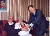 Hugh and Mary Mackie receive  a greetings card from the Queen delivered by Depute Lord Lieutenant Captain Jonathan Cardale  Click here to view full size.