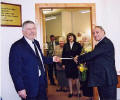  Councillor Hill cuts the ribbon to formally open the new Social Work office in Maybole, watched by Councillor Alan Murray. Among those through the doorway are Pearl Barton of Maybole OAP Association; Elaine Noad, director of Social Work, Housing and Health; and Mrs Helen Hill, wife of Councillor Hill. Click here to view full size.