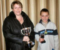 Linda presenting the trophy to Iain.
