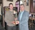 Carrrick Sports Club convener Alex Meek presenting the Scratch Trophy to Billy McCulloch